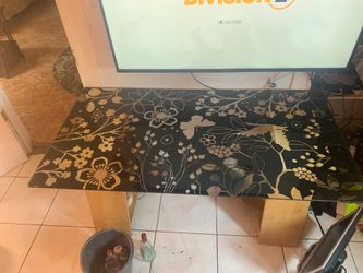 Glass table with flower design.