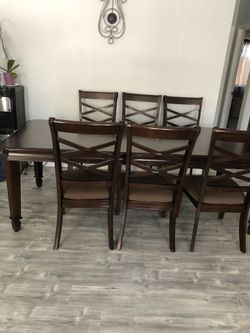 Brown dining table with 6 chairs