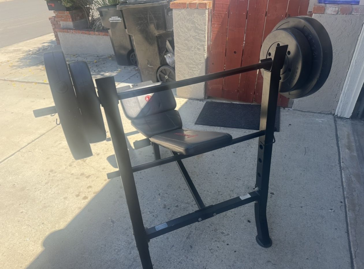 Adjustable bench with barbells and weights for sale
