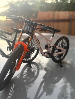 Miniature downhill mountain bikes *real working suspension* Black and White.