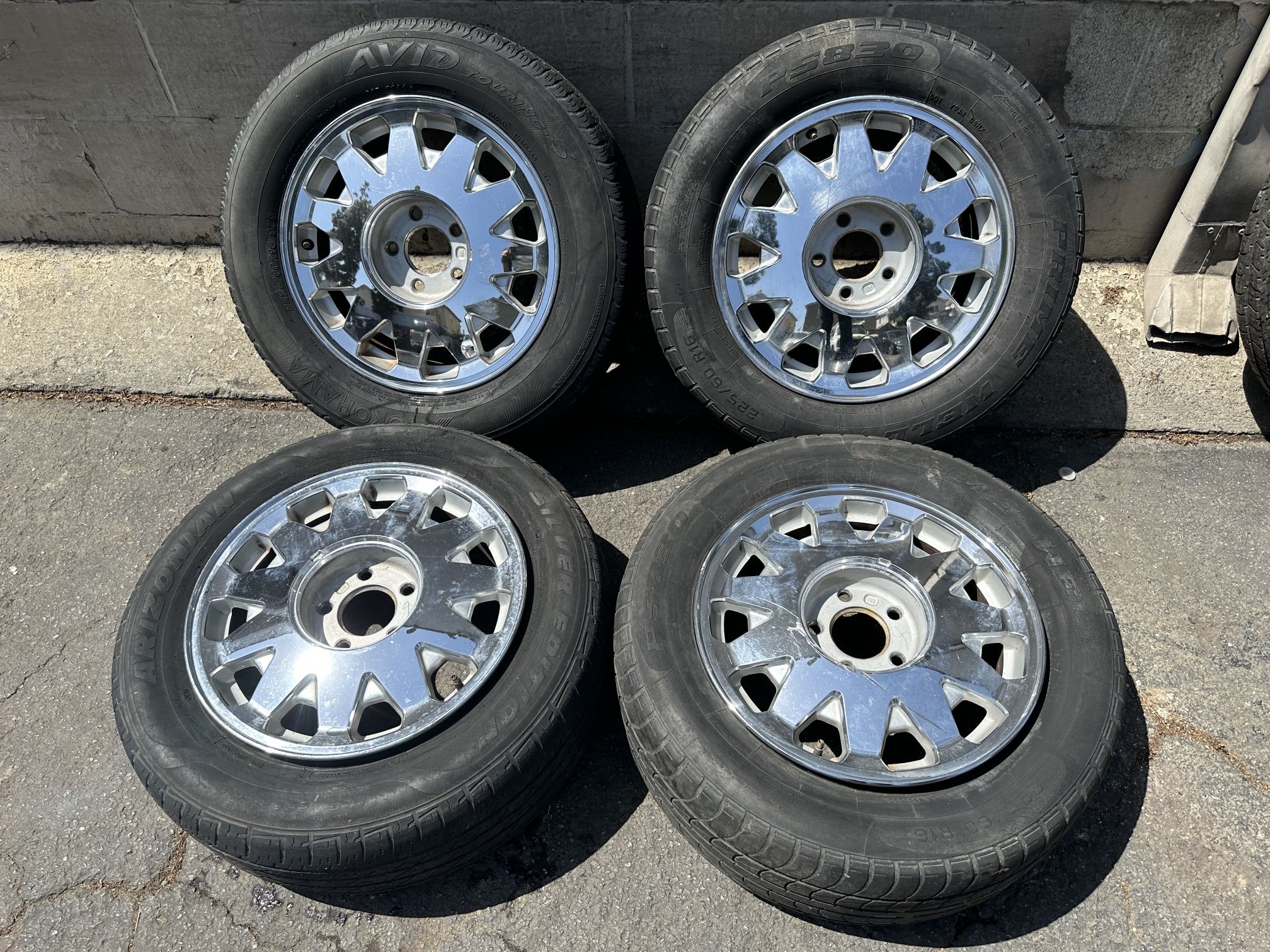 Cadillac Deville or Concours 16 inch stock chrome wheels. 5 on 115mm