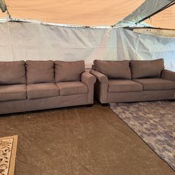 Gray couch and love seat they both have pullout beds great condition clean we saw all the time delivery $40 local