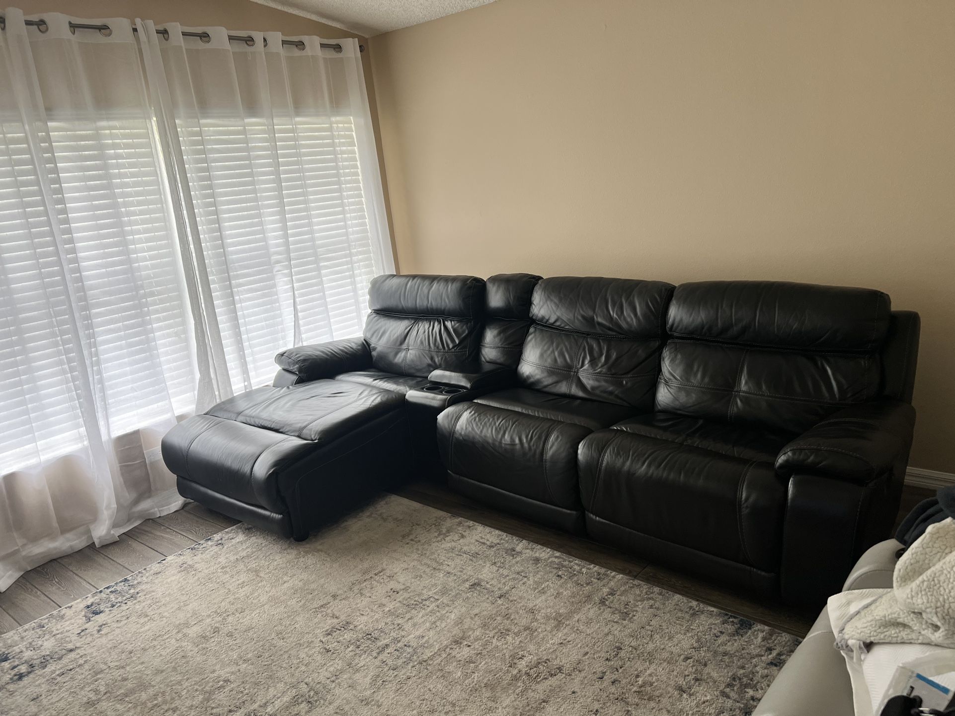 4pc reclining black leather sectional from El Dorado furniture…