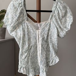 Free people flowery shirt in size Medium