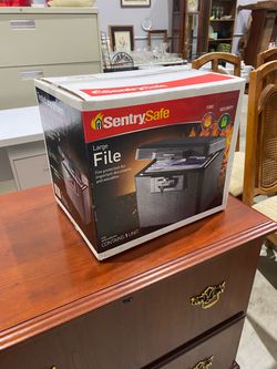 SentrySafe 1170 Fireproof Box with Key Lock inside its retail packaging, designed to provide UL-classified fire protection for important documents and