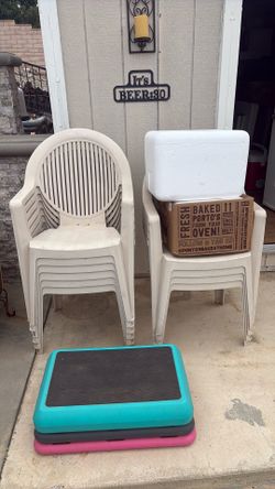 10 stackable patio chairs with two Styrofoam ice chest