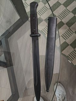 Sword I don't know what kind but it's very old fashioned I think I have the gun to it a wooden gun