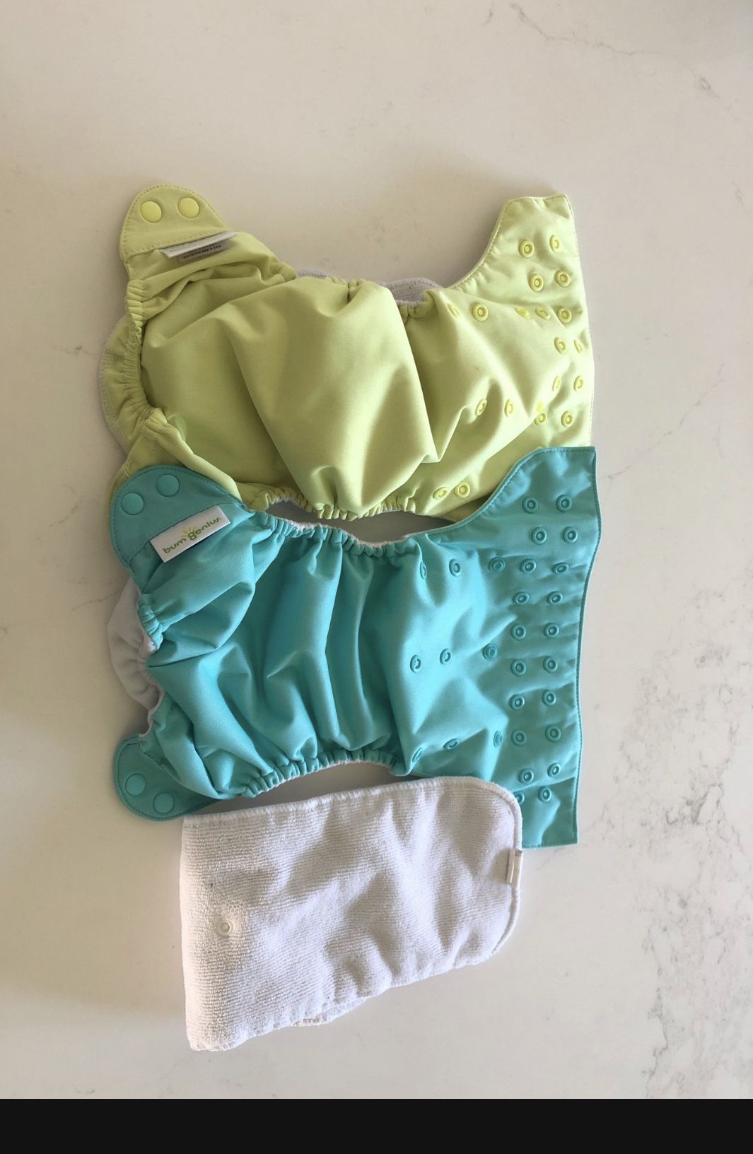 Bum genius, all in one and the original  cloth diapers