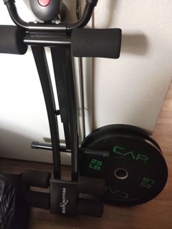 2 Olympic weight plates and ab exerciser