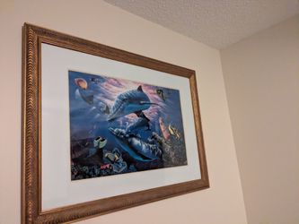 Dolphin print behind glass