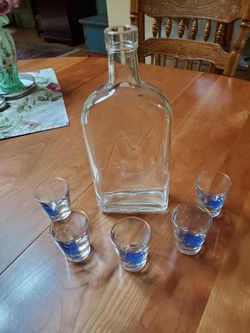 Bottle and shot glasses.