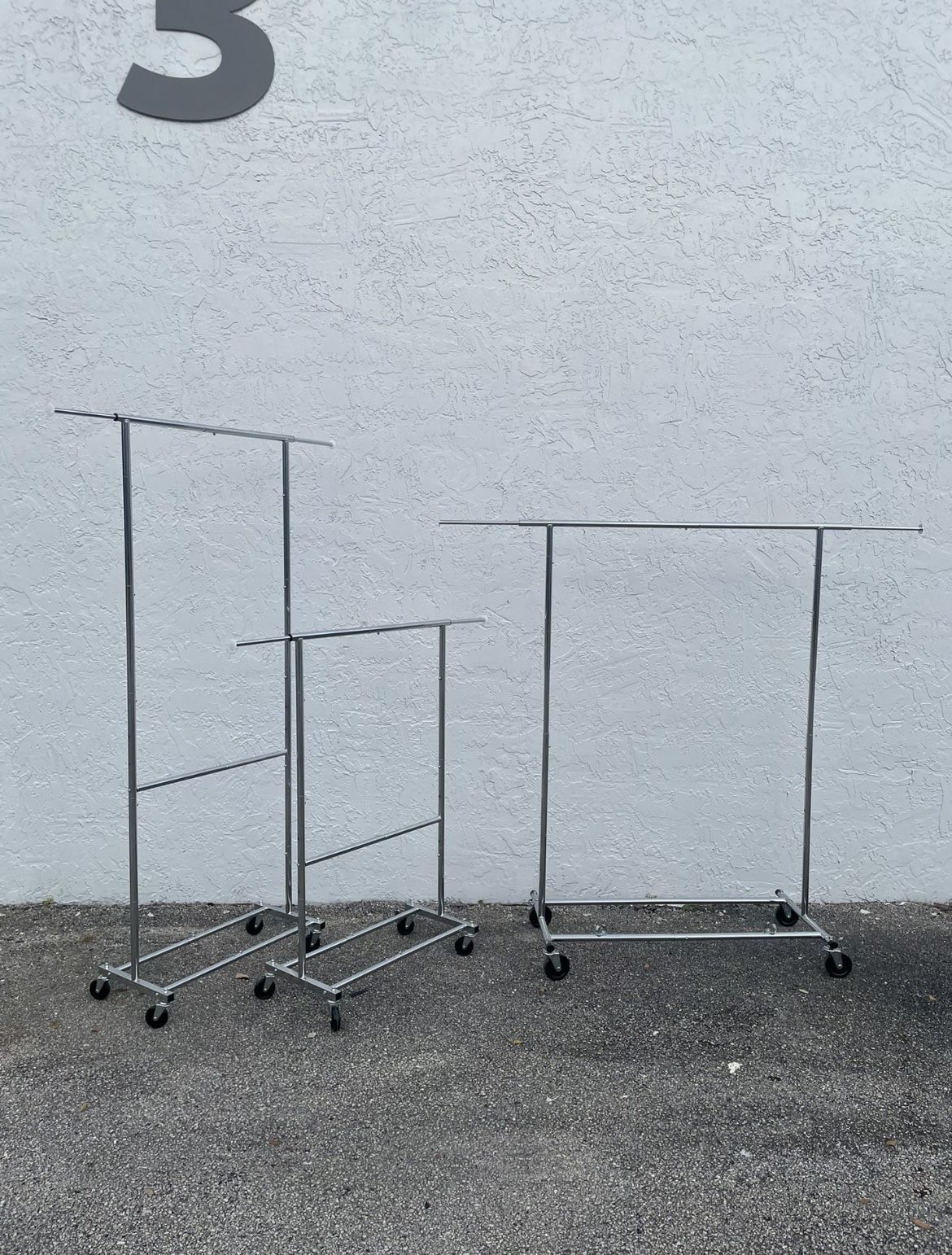 3 Adjustable Rolling Racks. 