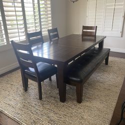 Dark Brown Wooden Dining Set And Area Rug