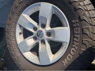 (4) DODGE RAM RIMS 17 FOR SALE WITH GOOD ALL TERRAIN TIRES !!