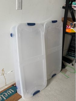 Two plastic bins with wheels