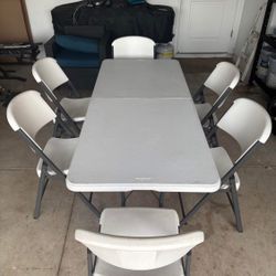6 Folding Chairs With 1 Table