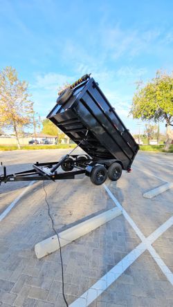 NEW DUMP TRAILER 12X8X4 12000 LBS
ROLLING TARP--SPARE TIRE,ELECTRIC BRAKES,HYDRAULIC SYSTEM,REMOTE CONTROL,IDEAL FOR HAULING, DEMOLITION, TRASH ETC,