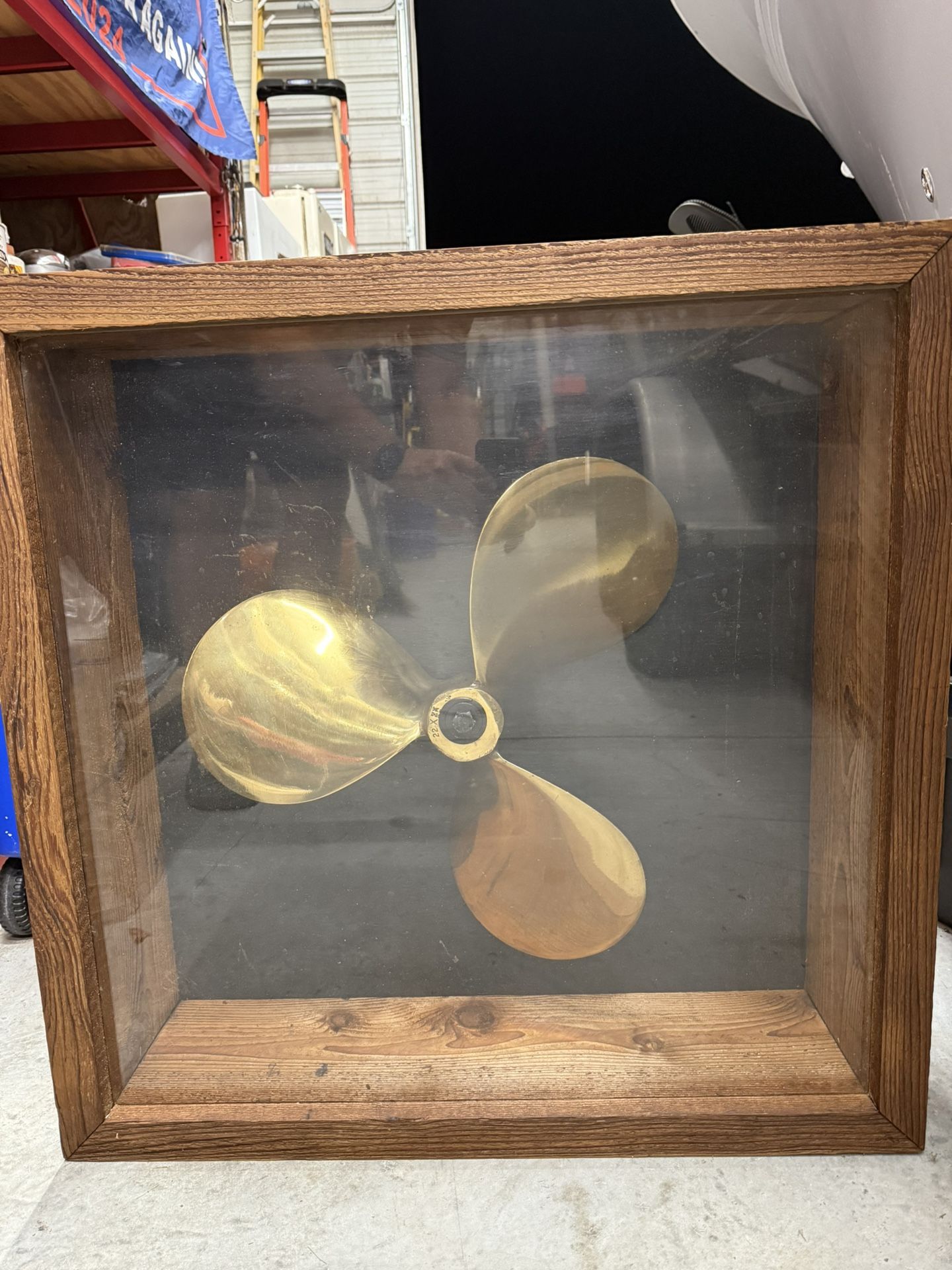 Vintage 22” brass ship propeller in wooden 30”x10” display case.