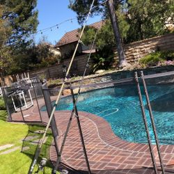   Two Daiwa Opus Saltwater Fishing Reels with Daiwa Surf 14’ Pier 10’ Fishing Rods 