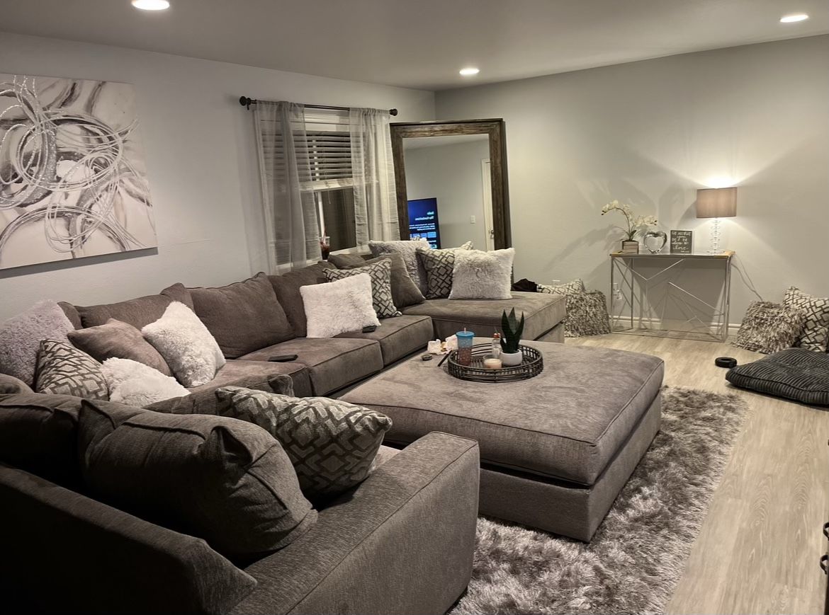 Couch ottoman, TV with tv stand and fire place  And coffee table 