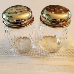 Glass And Silver Parmesan Cheese Shakers.