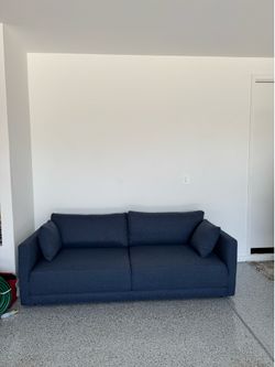 Excellent condition 3 seater sofa. Navy blue. Bought for $1699