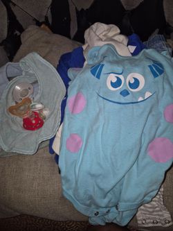 baby boy clothes and bids and pacifiers