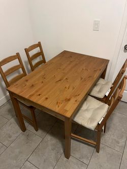 table four chairs and cushions
