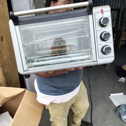 This item is a BLACK+DECKER 8-Slice Extra Wide Convection Toaster Oven (Model TO3250XSB). 
Features a large capacity interior designed to fit a 9"x13"