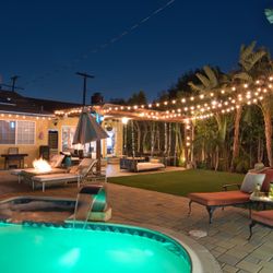 Stunning Pool Featuring A Bohemian Style Swing Bed