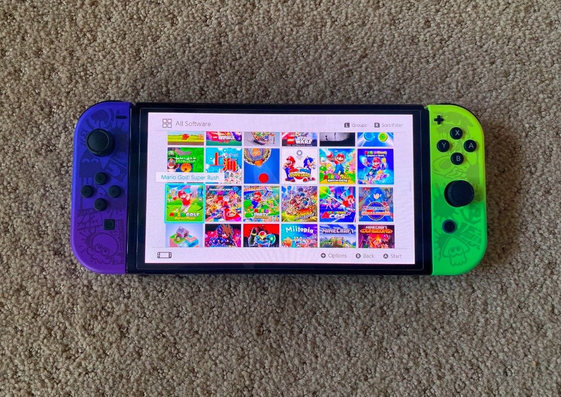 Switch OLED with 100 Switch Games and 7000 Classic Arcade Games