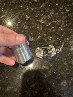 Small Slinkie And Silver Car 