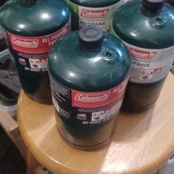 4 Full Coleman Propane Bottles. 12 All
