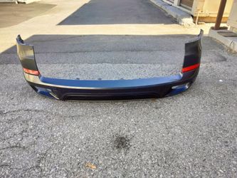 2011-2013 Bmw E70 X5 Rear bumper with all the accessories OEM.