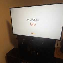 Tv stand with storage and lights and ports with the tv