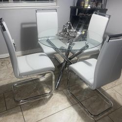 Silver Base And Glass Dining Table