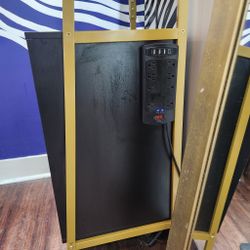Tall Black-and-Gold Storage Tower