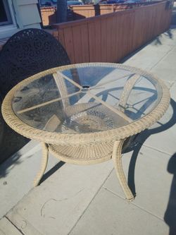 Round glass faux wicker dining table