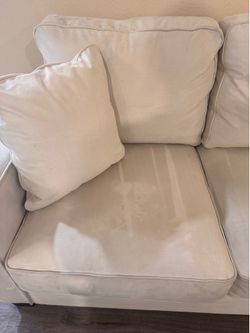 Cream microfiber couch with wood feet