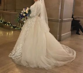 Stunning Wedding dress, One of a kind, worn for few hours , paid 5,000 but willing to let go for 2,500 OBO lots of beautiful details, size 8 adjusta