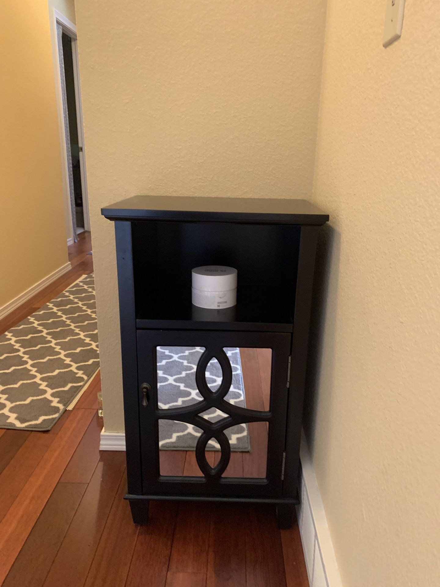 Small end table with mirrored cabinet door