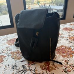 Black Universal Thread backpack with small side zipper pocket and pull-close front detail