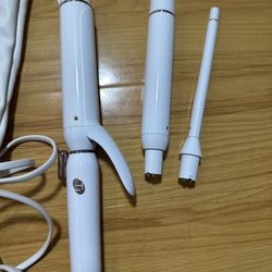 T3 interchangeable curling iron, used only once and still in great condition! Comes with pouch and barrel attachment(s), no box. Works perf