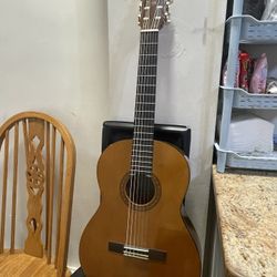 Yamaha Classical Acoustic Guitar Nell-loved Yamaha classical guitar with a warm, mellow tone - great for beginners, students, or casual players. Nylon