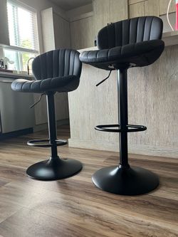 Two adjustable Swivel Bar Chairs