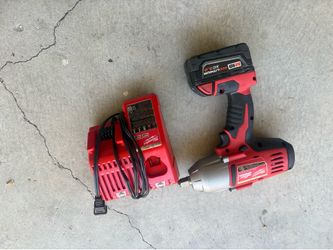 Milwaukee 1/2” tool, battery and charger READ
