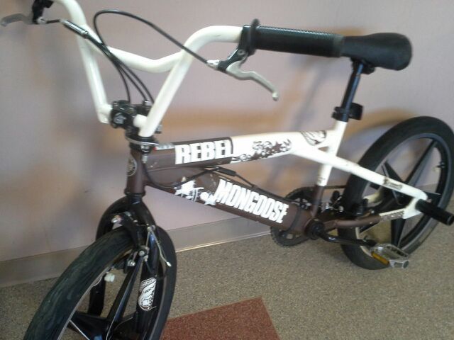 Brown and White Mongoose Rebel bike