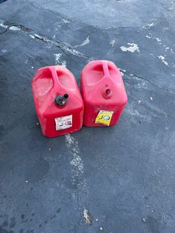 two 5 gallon gas jugs