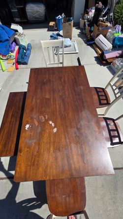 White and brown farm table with bench and 4 chairs