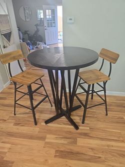 raised table with 2 chairs